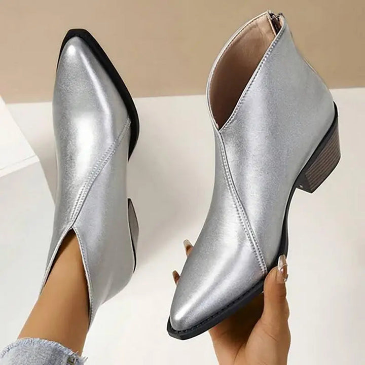 Fashion-forward women's platform ankle boots; trendy slip-on design with a pointed toe & elevated chunky heel.