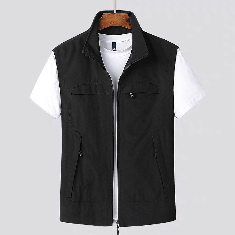 Functional men's utility vest in black, featuring multiple secure zip pockets, ideal for tools or travel essentials.