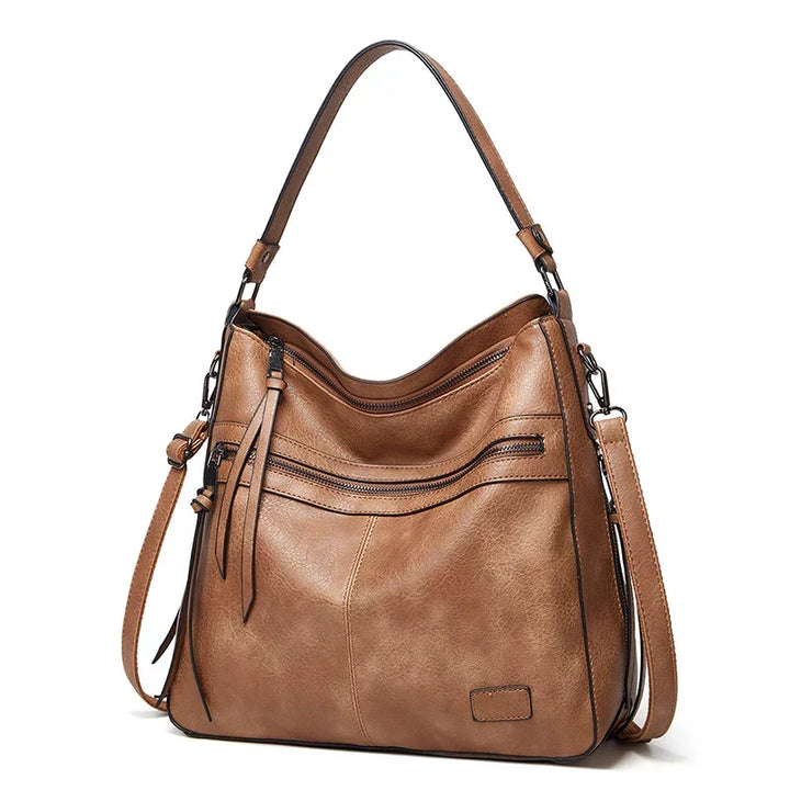 Close-up of durable genuine leather women's handbag, showcasing texture and quality craftsmanship.
