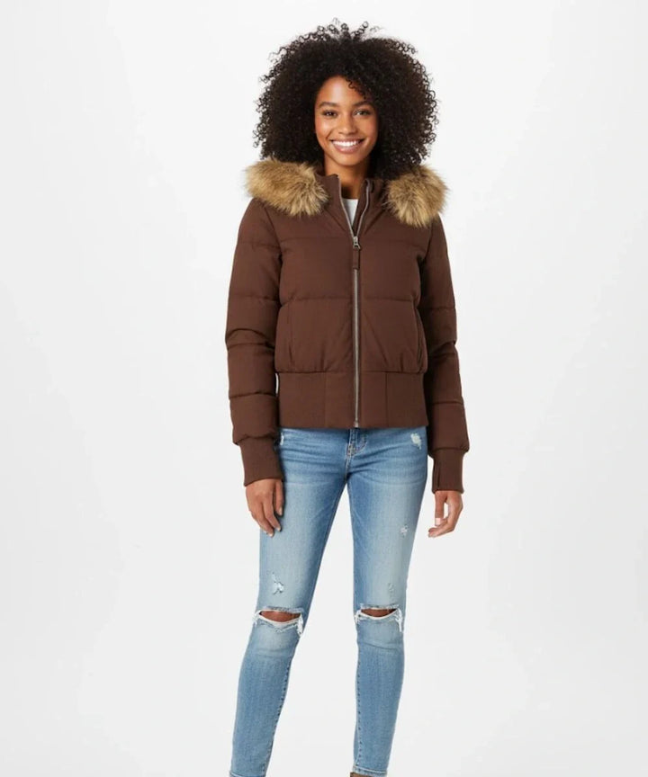 Chic women's outerwear: a warm, slim fit puffer jacket with faux fur hood.