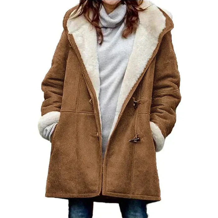 Cozy women's winter coat, hooded with toggle closure. Essential warm jacket for cold weather style.