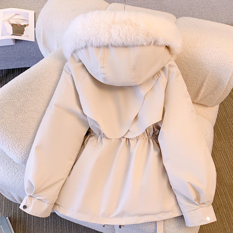 Warm ladies' elegant winter coat. Insulated outerwear designed for stylish cold weather and everyday fashion.
