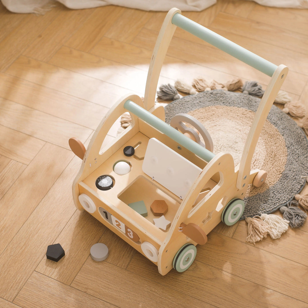 Developmental wooden Montessori stroller for toddlers, promoting fine motor skills & first steps with play.