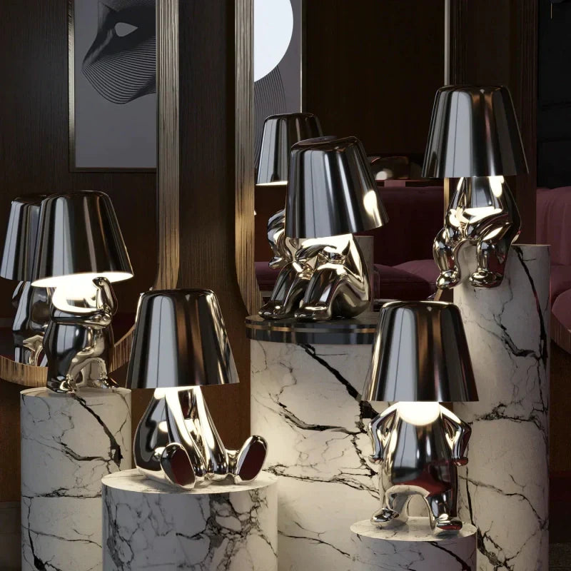 Portable LED figurine lamp, USB rechargeable. Cordless decorative light for unique home decor.