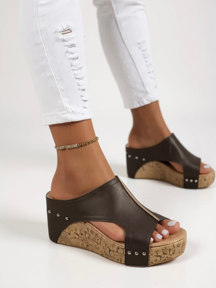 Stylish women's wedge slide sandals, ideal for comfortable daily wear or elegant casual summer outfits.