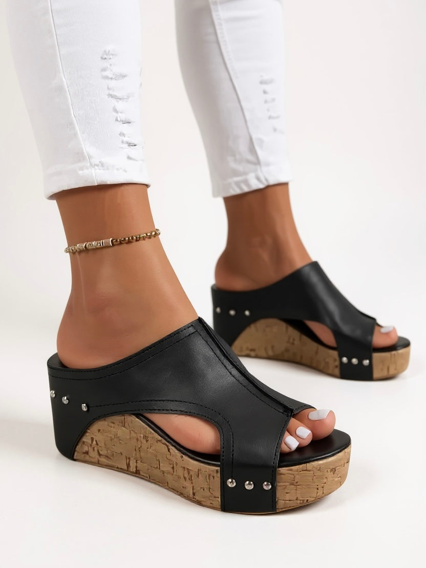 Chic slip-on wedge sandals for women, offering elegant style and easy comfort for any summer occasion.