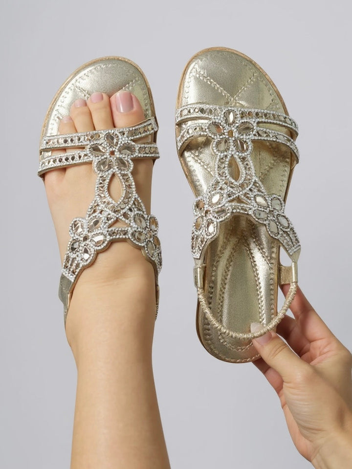 Flat women's comfort sandals, featuring sparkling embellishments for a touch of glamour.