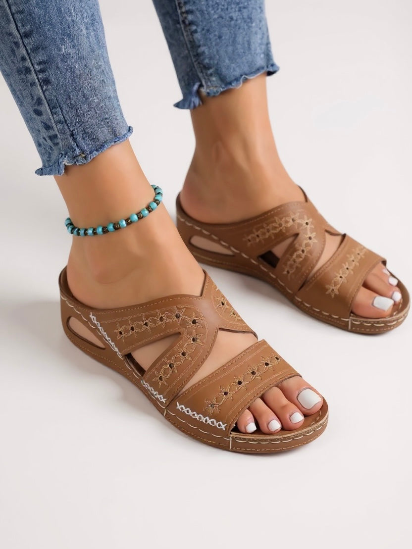 Comfortable embroidered women's slides, a chic slip-on sandal for casual elegance.