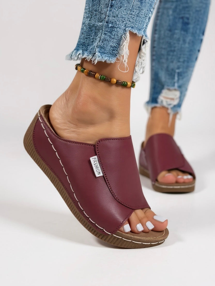Women's platform slides; modern, breathable footwear, perfect for summer & casual outings.