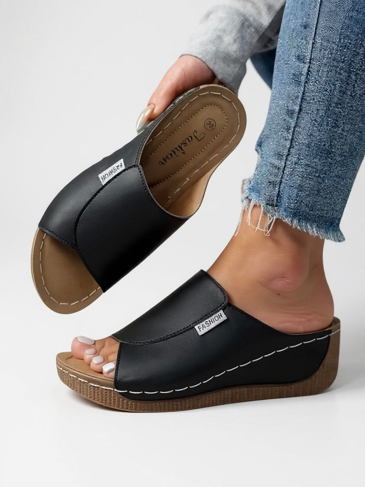 Women's comfortable platform slides; lightweight, slip-on, & breathable for summer fashion.