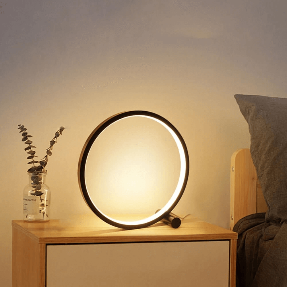 Modern white LED table lamp, dimmable for bedroom ambient light. Touch control for comfortable nightstand use.