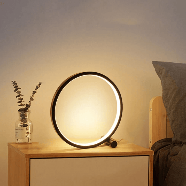 Modern white LED table lamp, dimmable for bedroom ambient light. Touch control for comfortable nightstand use.