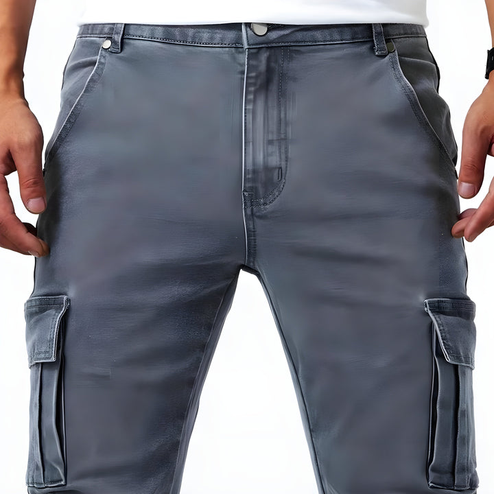 Close-up of the multi-pocket detail on modern men's slim fit cargo pants, showcasing practical design.