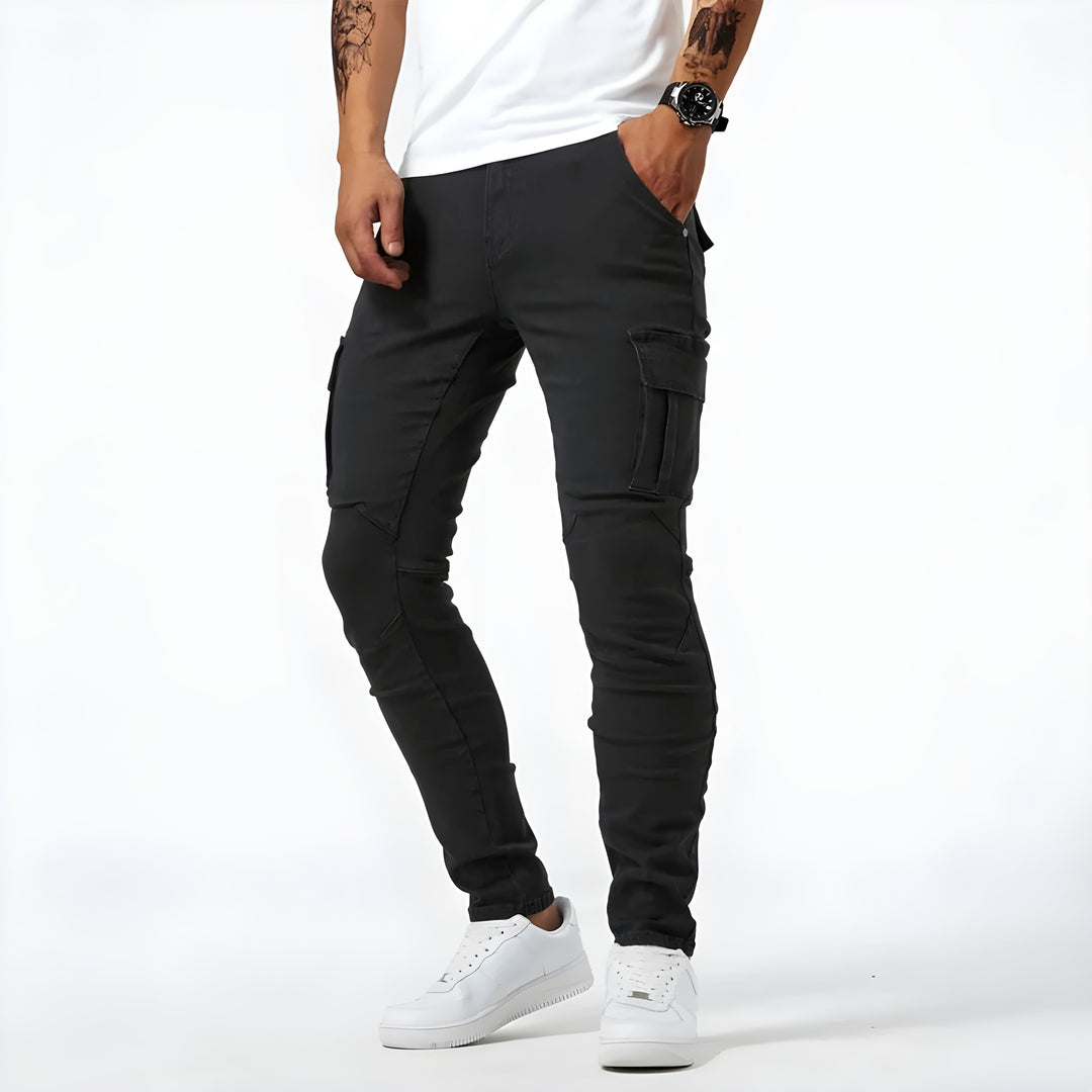 Man wearing comfortable grey slim fit cargo pants, styled for a casual, trendy look and versatile outdoor wear.