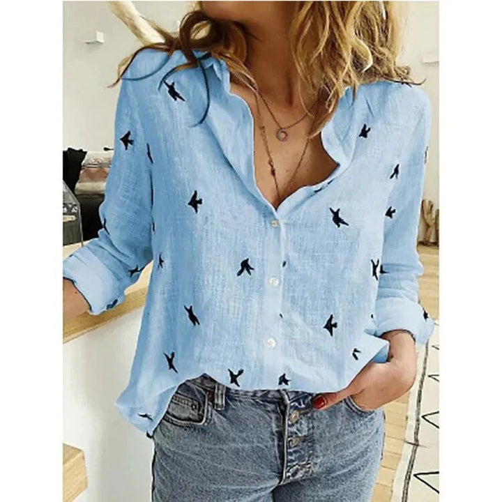Stylish printed women's summer blouse, relaxed fit, long sleeve. Perfect for elegant casual fashion.