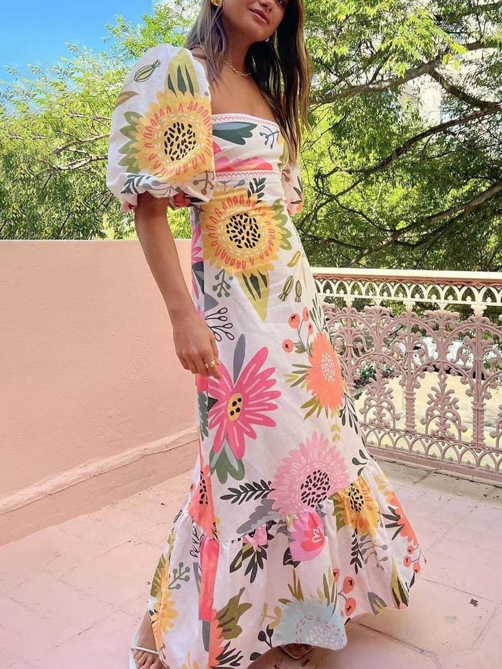 Women's Blossom Breeze floral maxi summer dress with v-neck and adjustable straps, perfect for beach or vacation.