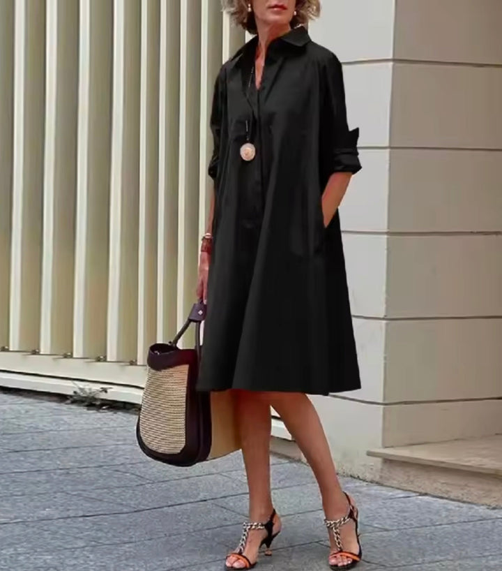 Elegant women's collared shirtdress, button-front A-line silhouette with practical pockets for casual or work.