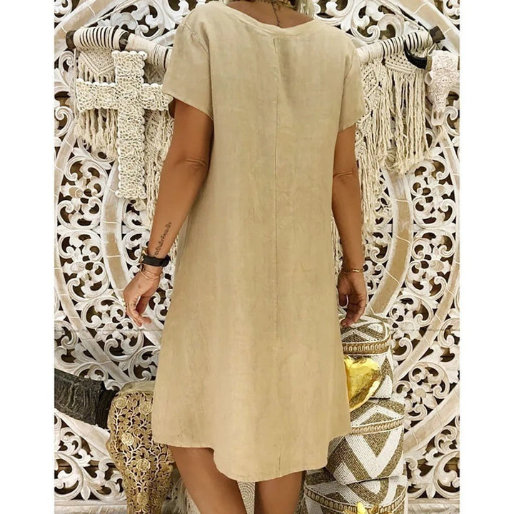 Flattering A-line mini dress for women, featuring a stylish V-neck and comfortable short sleeves.