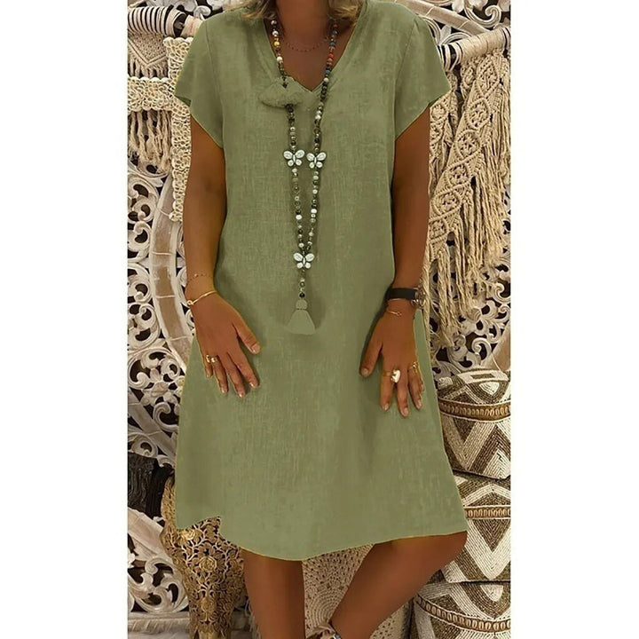 Stylish women's A-line mini dress with V-neckline and short sleeves, great for spring everyday wear.