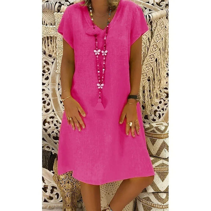 Vibrant women's short sleeve A-line mini dress, featuring a chic V-neck for versatile spring-summer fashion.