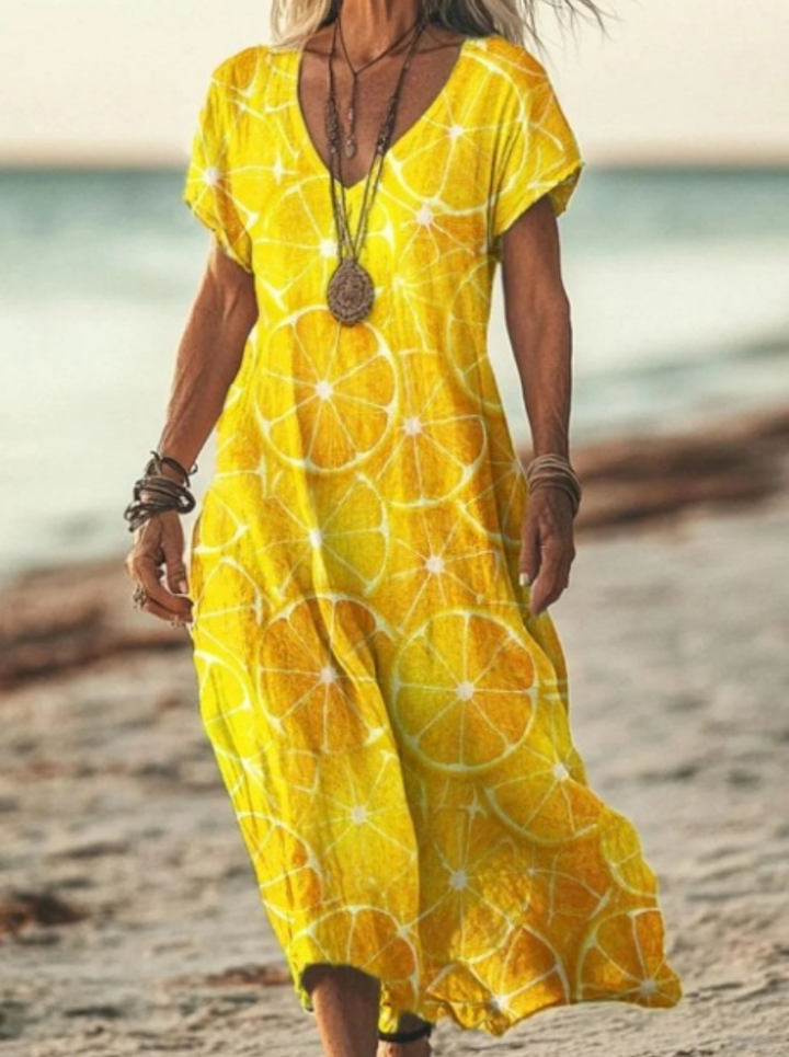 Close-up of vibrant floral print on a women's midi dress. Highlights the comfortable fabric and elegant pattern.