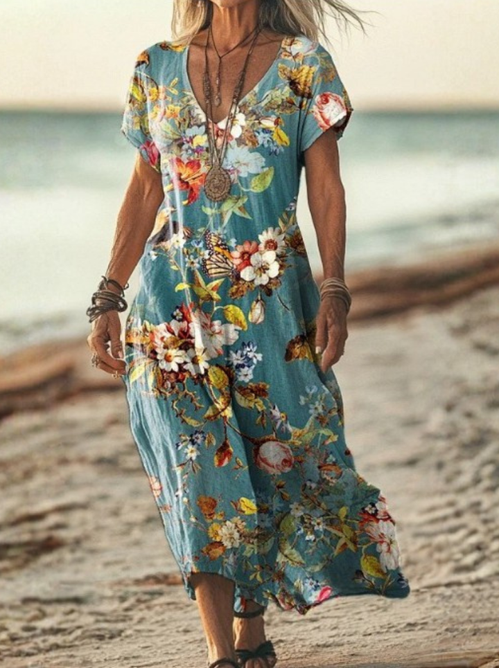 Flowy women's floral print midi dress, showcasing the comfortable back design. Versatile for elegant summer wear.