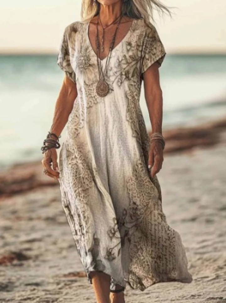 Woman twirling in a flowy women's floral print midi dress. Highlights comfortable movement and elegant summer style.
