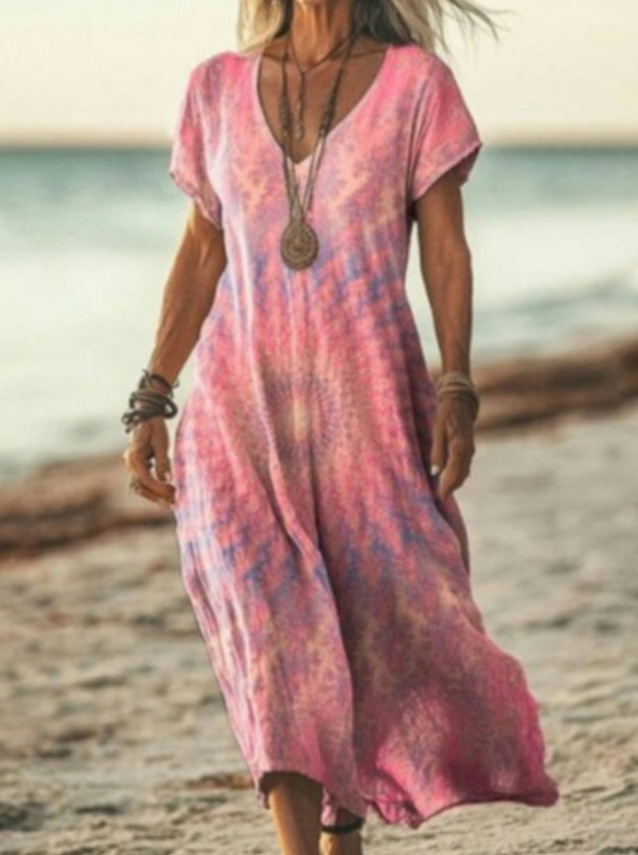 Women's elegant floral print midi dress on hanger. Displays flowy fabric, comfortable design, and versatile appeal.