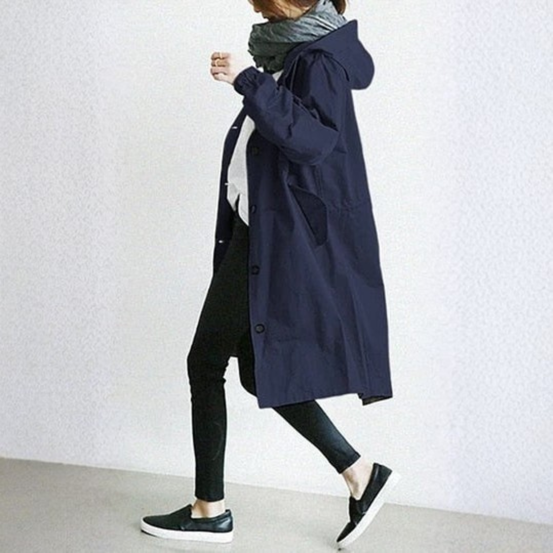 Protective women's waterproof rain jacket, ensuring dry comfort for casual outerwear, city commutes & travel.