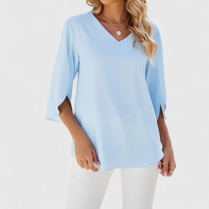 Detail shot: Elegant women's ruffle V-neck half-sleeve blouse, showcasing fabric and design.