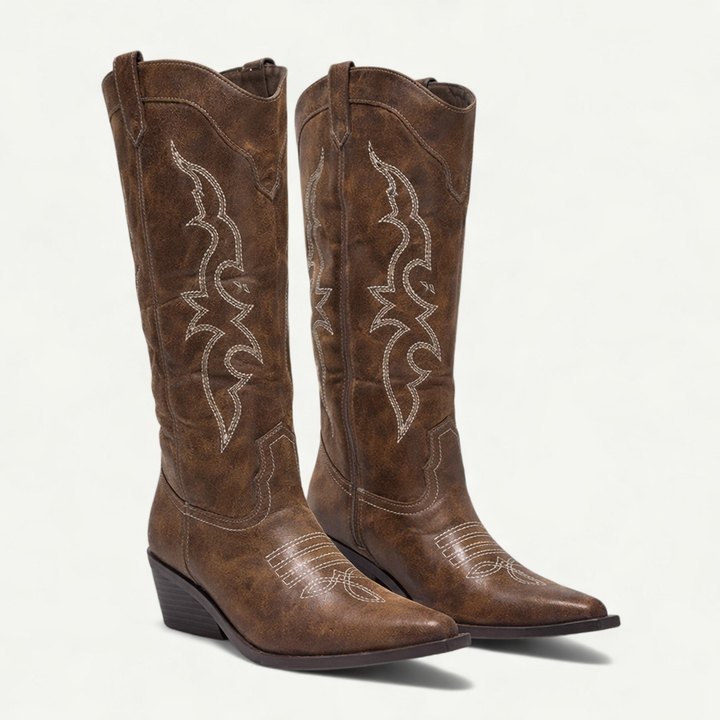 Stylish women's Western pointed-toe calf-high boots. Comfortable with good ankle support.
