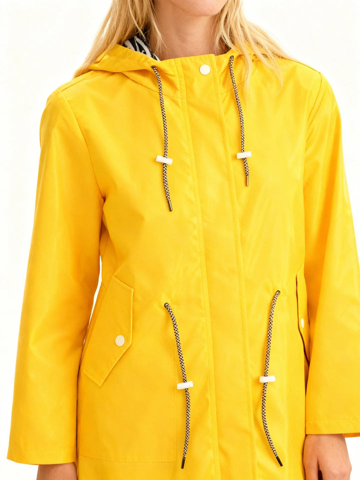 Lightweight women's water repellent hooded rain jacket, ideal for travel and casual everyday outerwear.