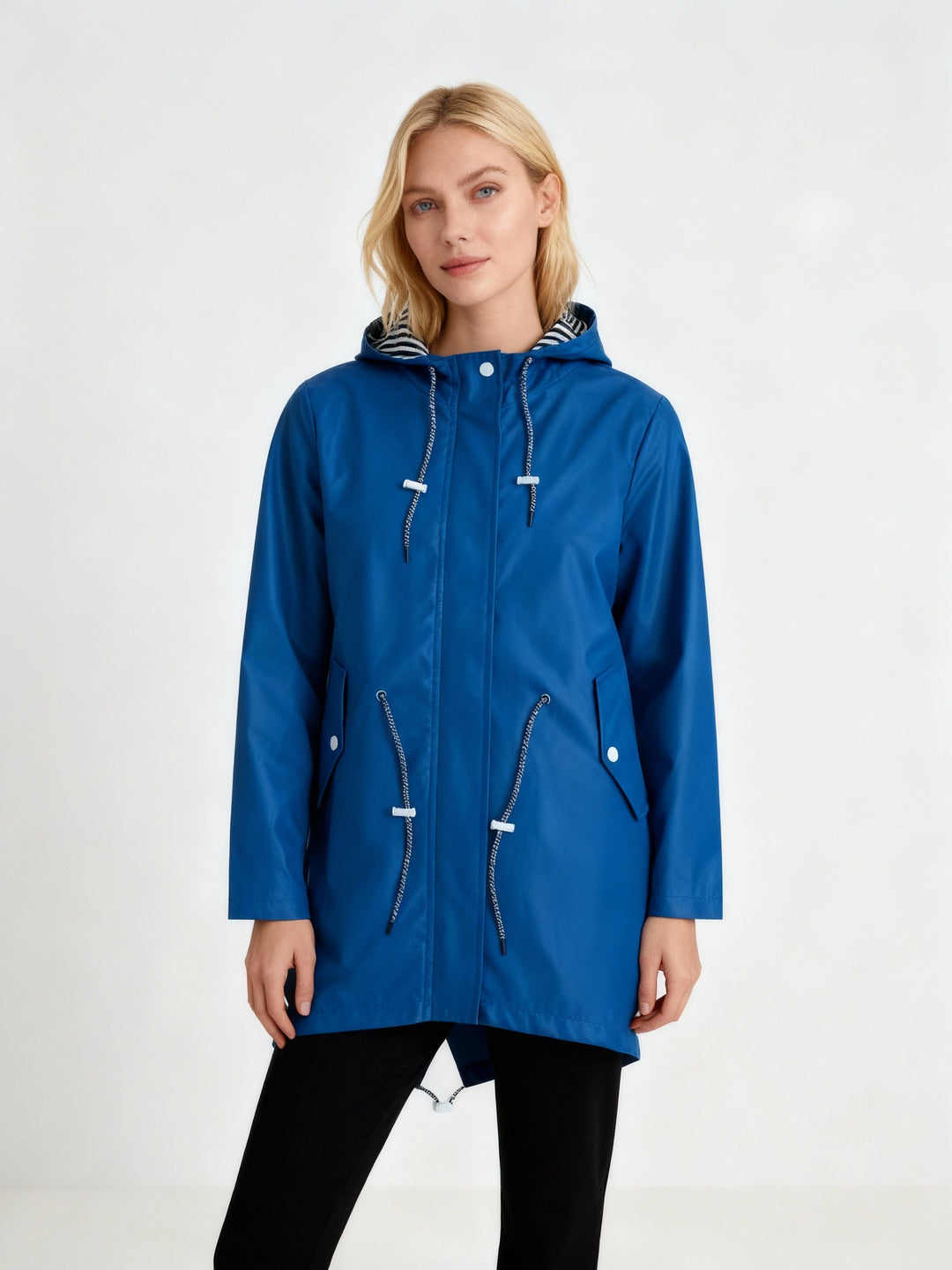Women's practical hooded rain jacket with water repellent fabric for spring and fall weather protection.