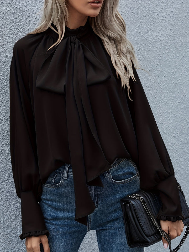 Stylish women's tie-neck long sleeve blouse, an elegant fashion top for any wardrobe.