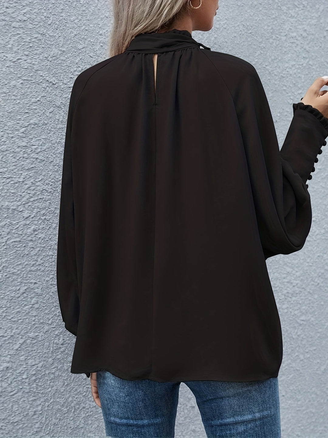 Elegant women's tie-neck long sleeve blouse, ideal for chic and professional looks.