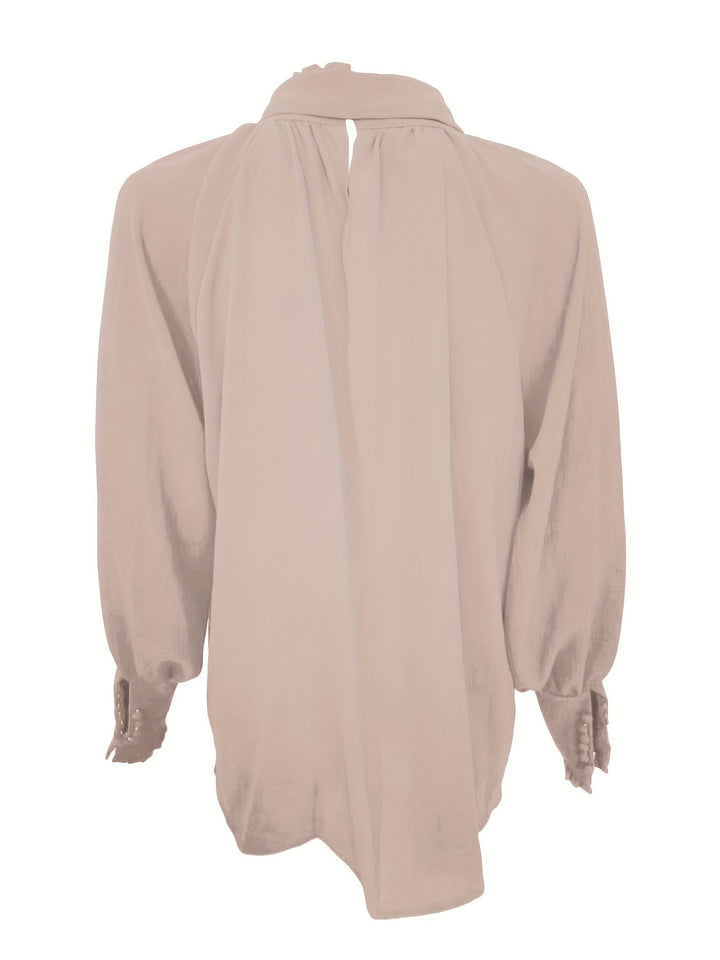 Women's fashion blouse featuring a graceful tie neck and comfortable long sleeves.