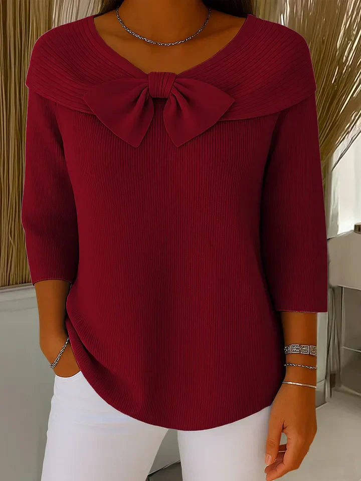 Versatile women's elegant knit sweater with a sophisticated bow detail, offering cozy comfort and chic style.