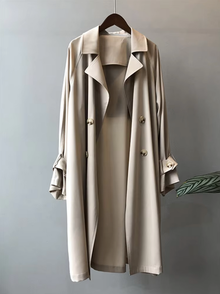 Classic women's black waterproof trench coat, a versatile long jacket with timeless style for elegant spring and autumn fashion.