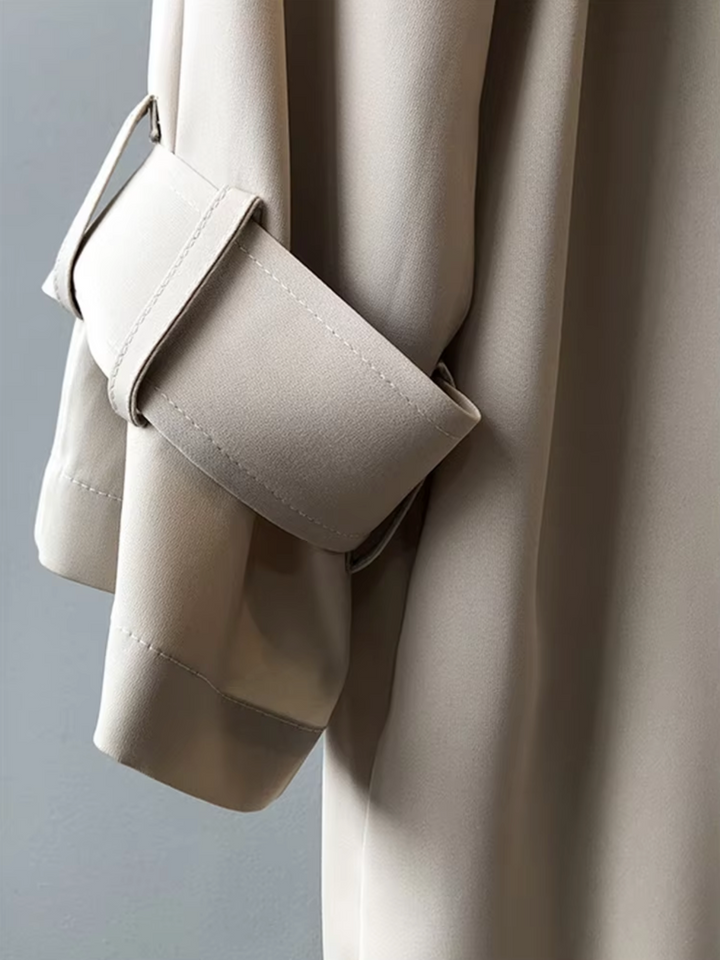Women's timeless waterproof long trench coat, showcasing its elegant design and versatile protection for rain and cooler weather.
