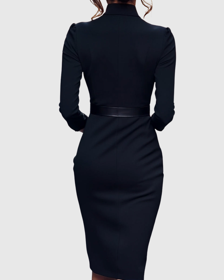 Side profile of a women's elegant midi dress, highlighting the structured silhouette & belted waist.