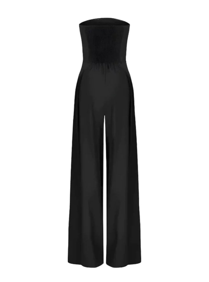 Modern women's strapless wide leg jumpsuit, exuding chic summer style for elegant day or evening.