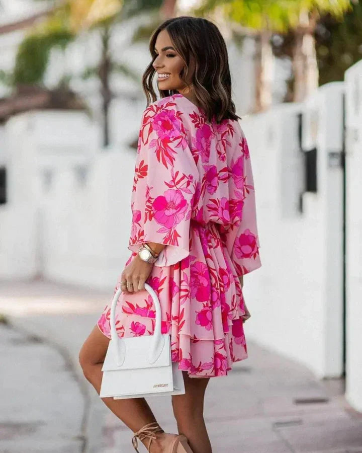 Vibrant patterned flowy women's summer dress, comfortable and stylish for any warm-weather occasion.