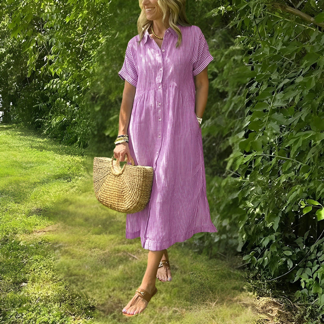Versatile women's striped midi dress, featuring a flattering fit and comfortable design for everyday elegance.