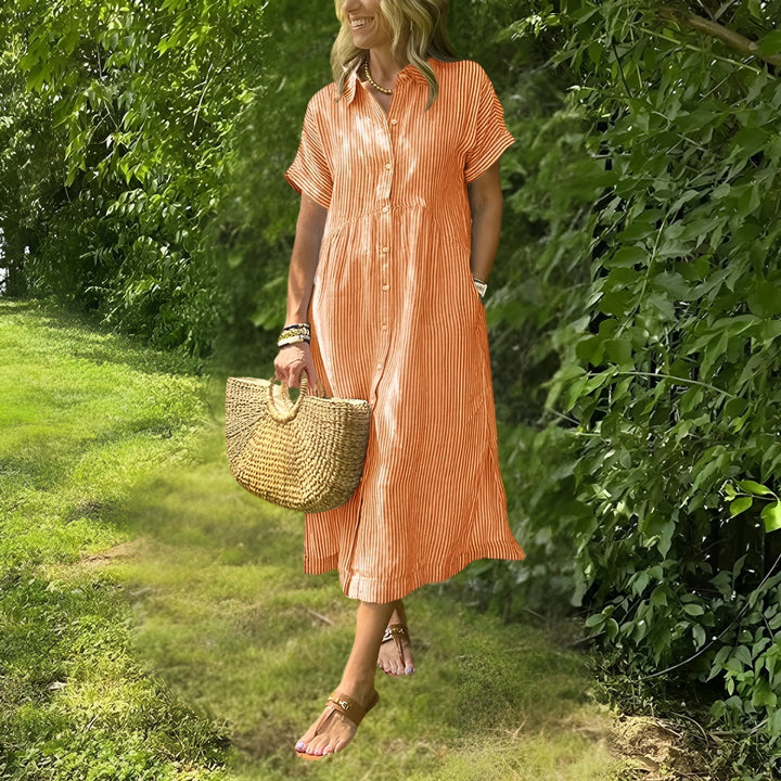 Stylish women's midi dress with elegant stripes and long sleeves, ensuring a flattering and chic look.