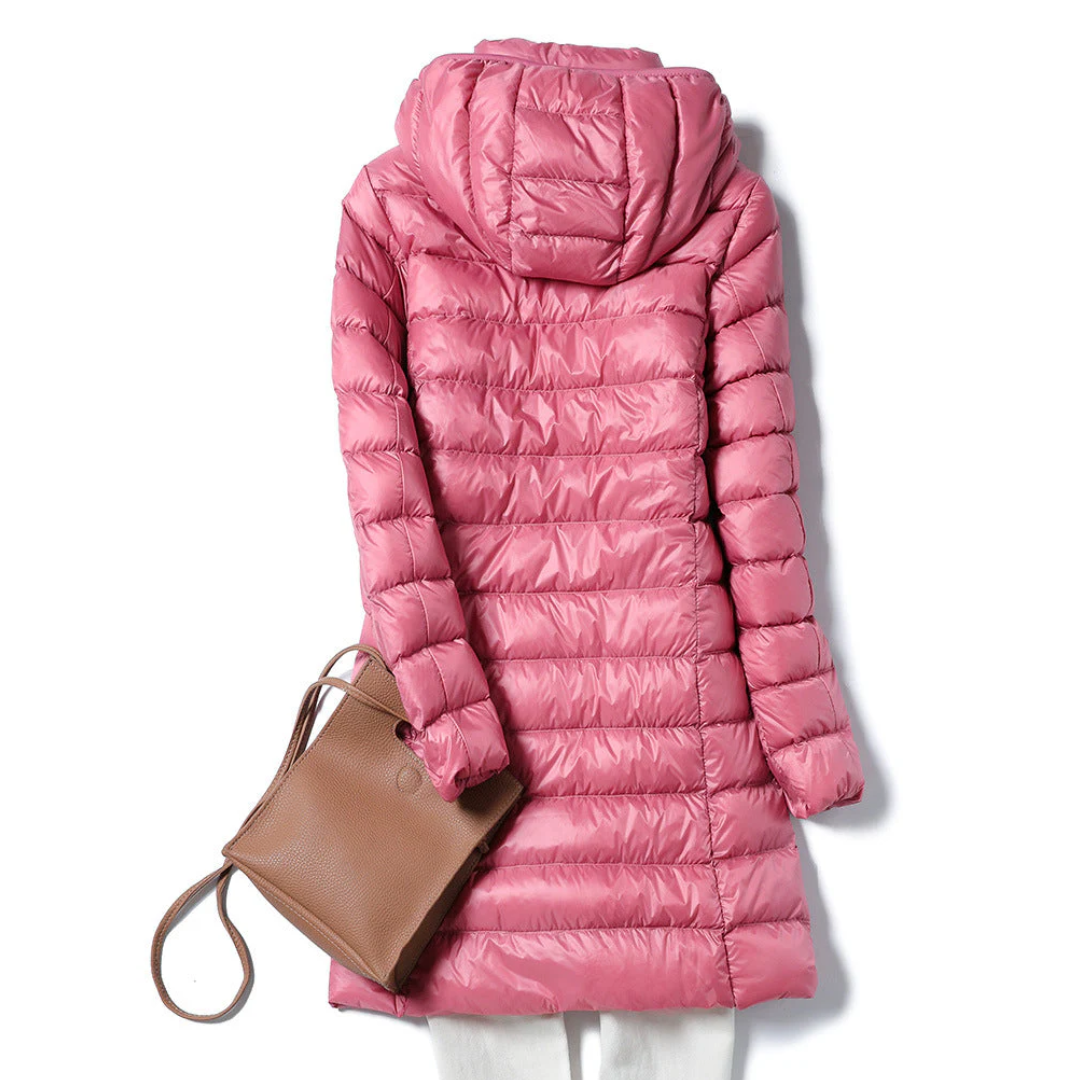 Stylish women's long puffer jacket, lightweight and elegant for versatile cool weather fashion.
