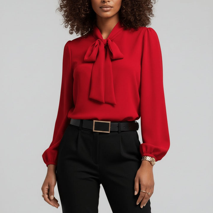 Elegant women's bow-tie long-sleeve blouse for versatile office wear. Relaxed fit with sophisticated puff sleeves.