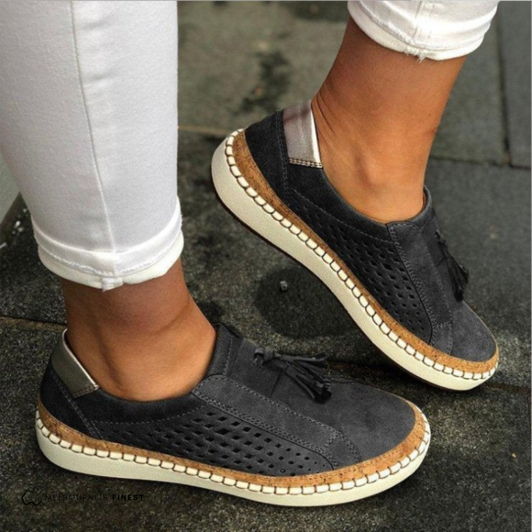 Stylish women's slip-on footwear, perfect for daily wear, offering cushioned support & breathable comfort.