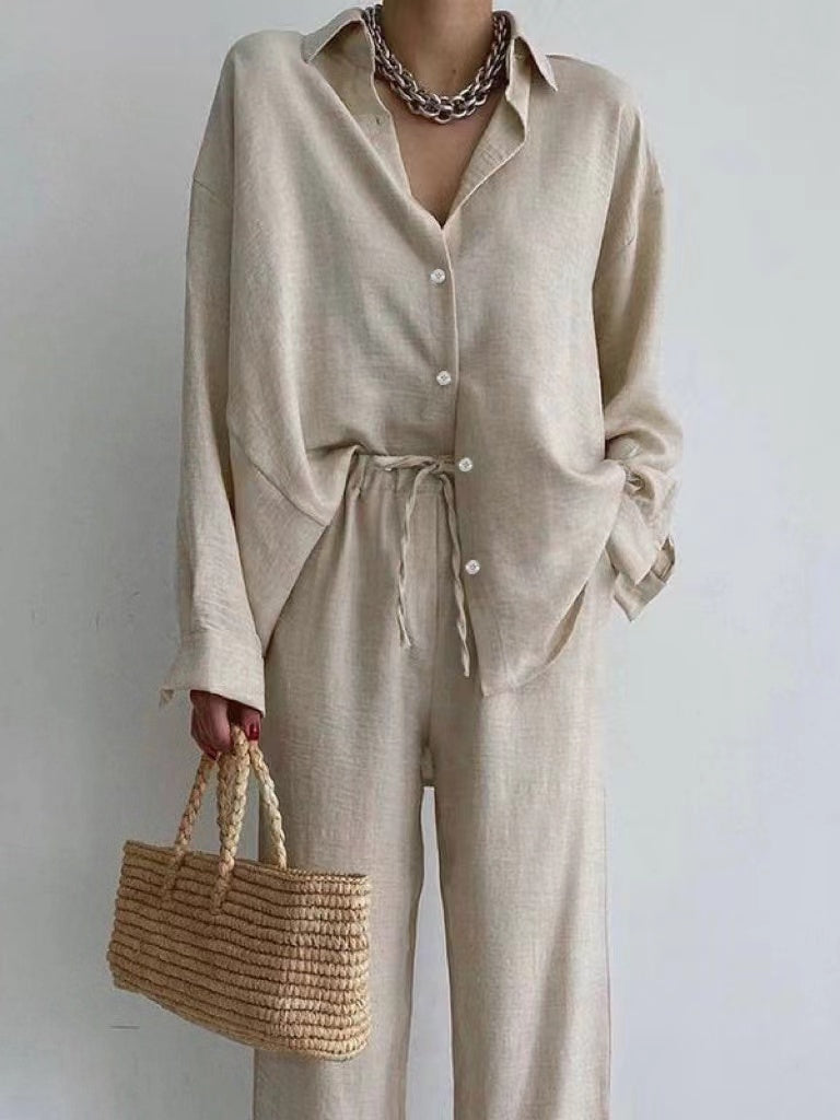 Women's elegant two-piece blouse and wide leg pants set, perfect for summer casual or travel. Relaxed fit.