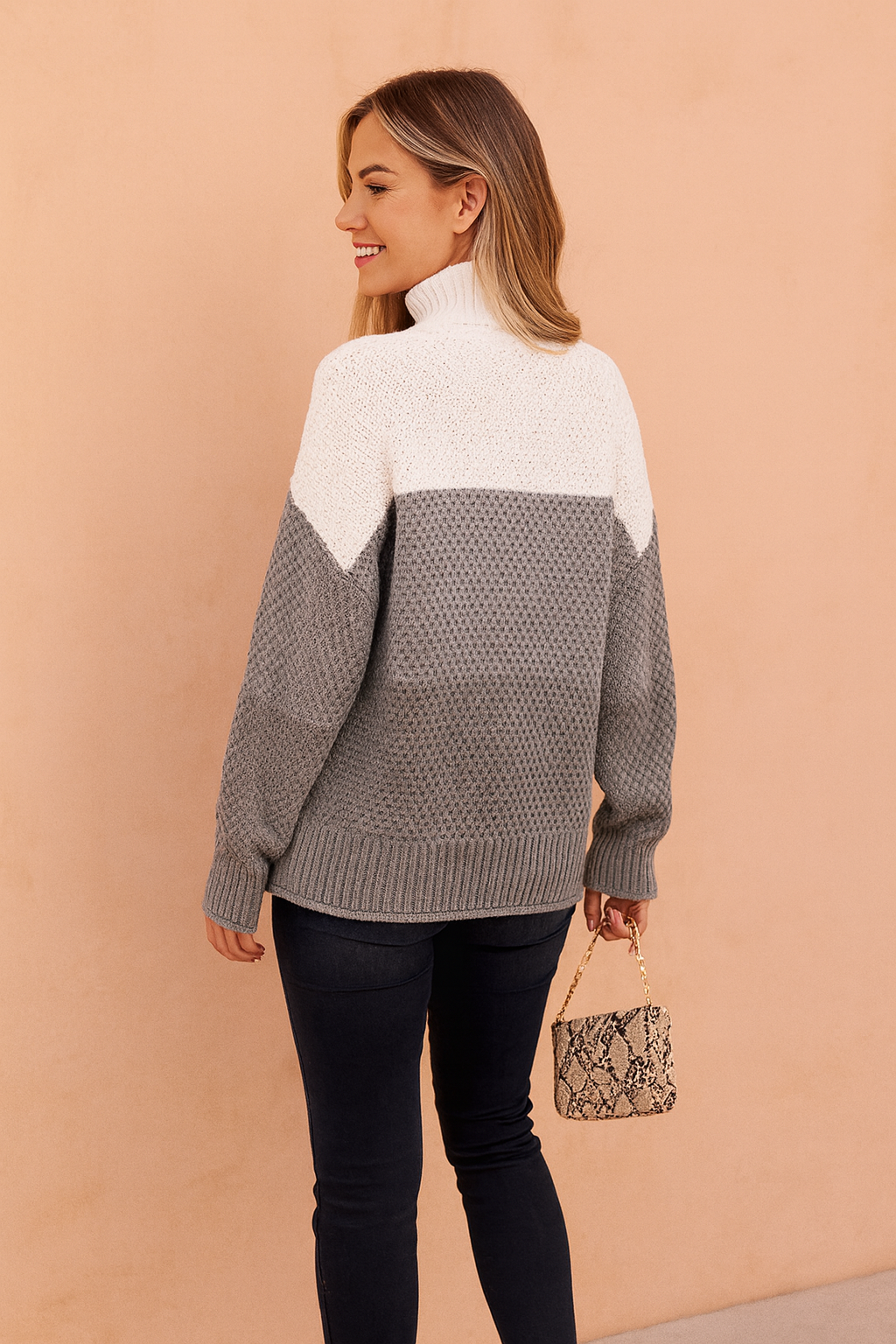 Versatile gray women's striped sweater. Chic, classic knit for casual or elegant everyday styling.