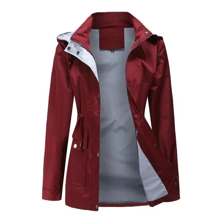 Close-up of women's waterproof trench coat's durable fabric, elegant belt, and button details. Autumn jacket.